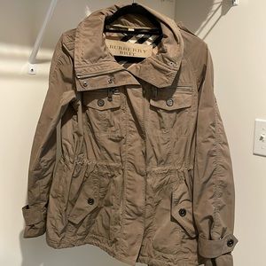 Designer BURBERRY Women’s trench style rain jacket with removable hood.